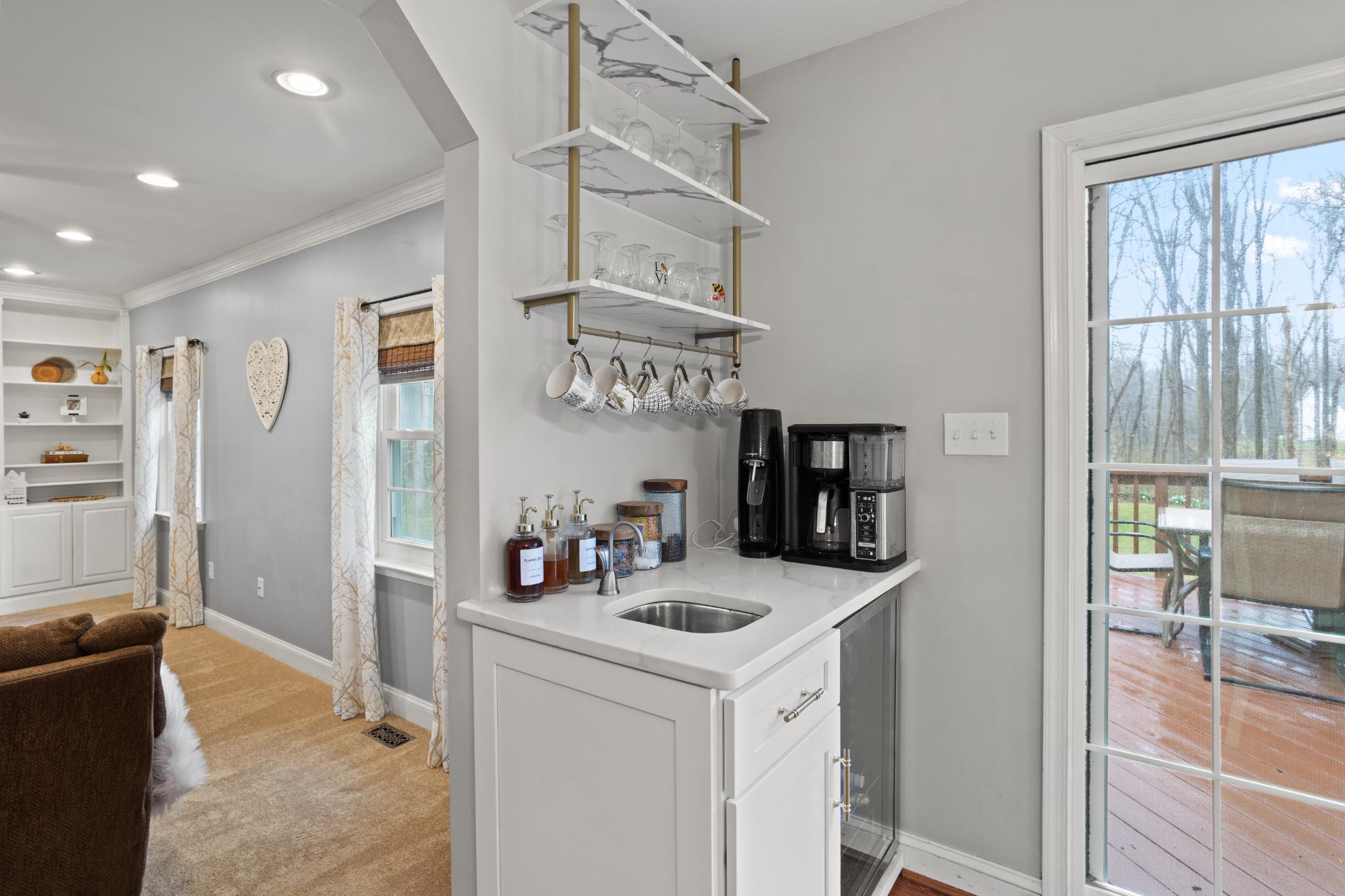 1860 Battery Lane Owings, MD 20736 - Photo 9 of 120 a kitchen that has a lot of cabinets and wooden floor