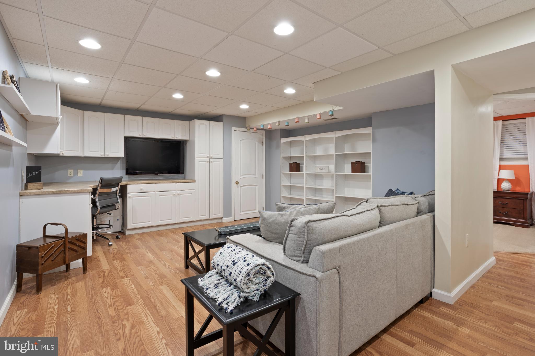 1860 Battery Lane Owings, MD 20736 - Photo 92 of 120 Modern basement retreat with cozy ambiance.