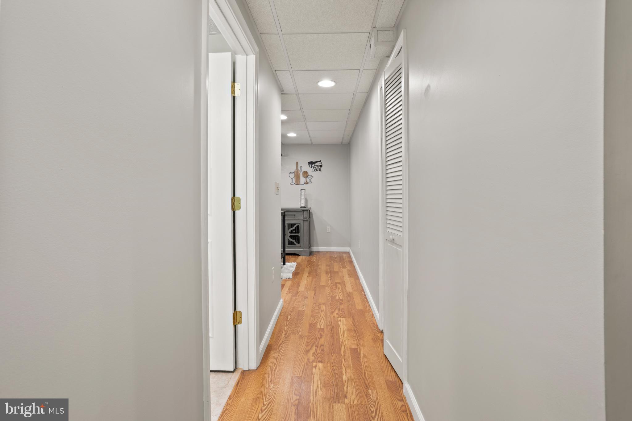 1860 Battery Lane Owings, MD 20736 - Photo 96 of 120 Bright and inviting hallway with warm tones.