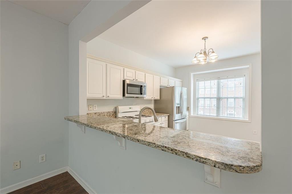 5589 Trace Views Drive Norcross, GA 30071 - Photo 16 of 58 a bathroom with granite countertop granite top and a sink
