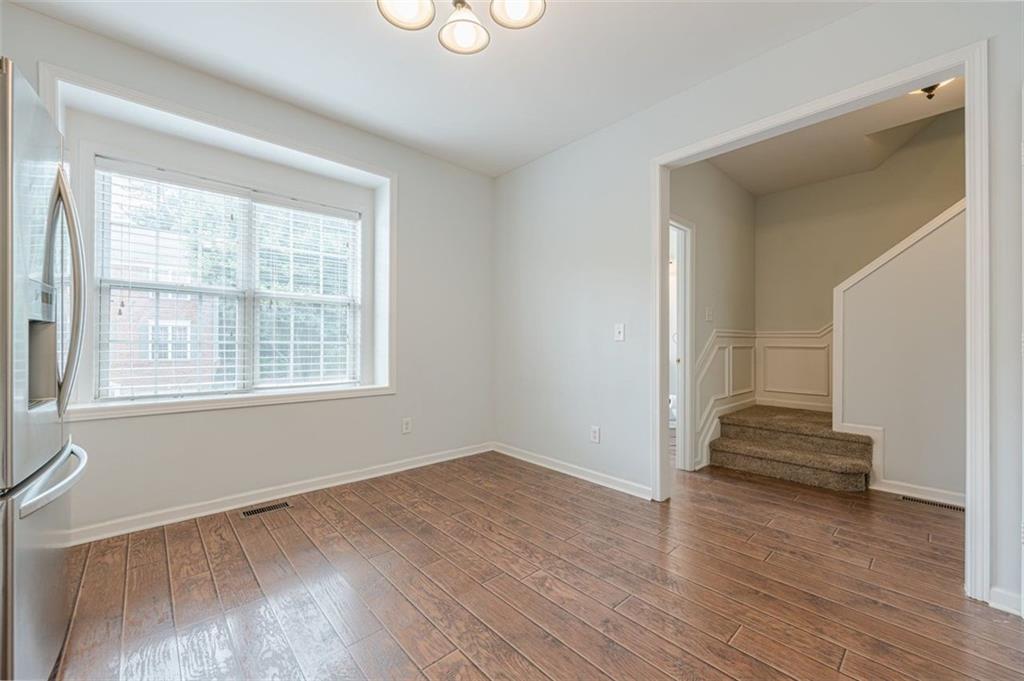 5589 Trace Views Drive Norcross, GA 30071 - Photo 21 of 58 a view of an empty room with wooden floor and a window