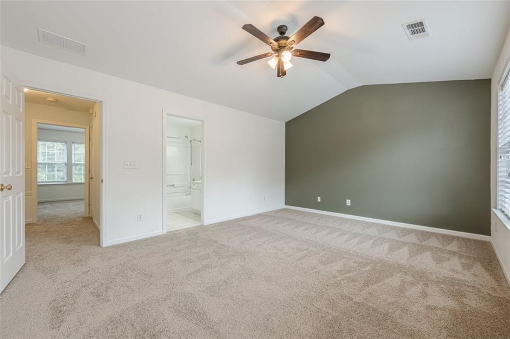 5589 Trace Views Drive Norcross, GA 30071 - Photo 24 of 58 an empty room with fan and windows