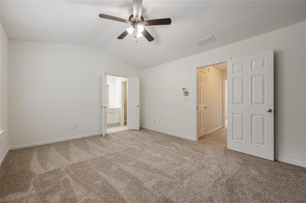 5589 Trace Views Drive Norcross, GA 30071 - Photo 27 of 58 an empty room with chandelier fan