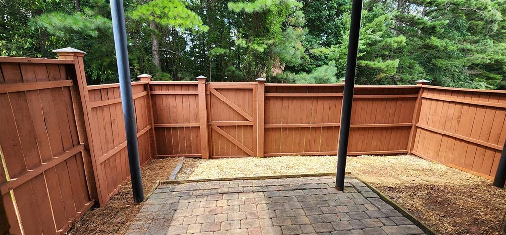 5589 Trace Views Drive Norcross, GA 30071 - Photo 39 of 58 a view of a balcony with wooden floor and fence
