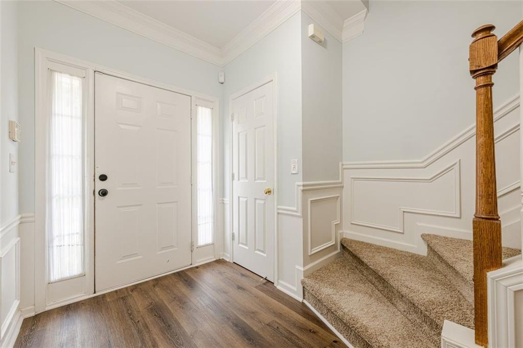 5589 Trace Views Drive Norcross, GA 30071 - Photo 4 of 58 a view of a room with wooden floor and cabinet