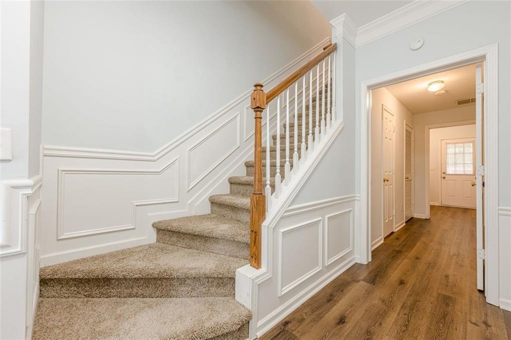 5589 Trace Views Drive Norcross, GA 30071 - Photo 5 of 58 a view of entryway and hall with wooden floor