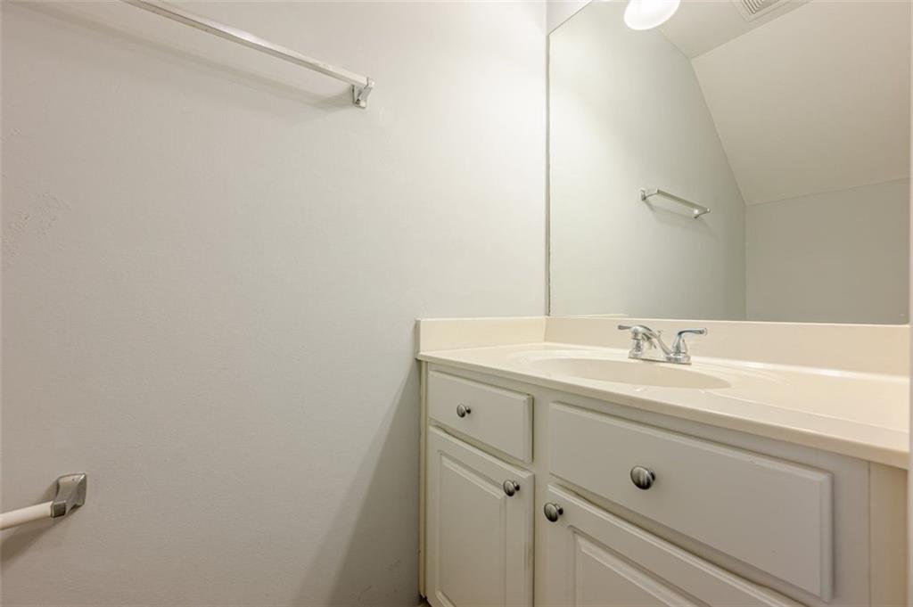 5589 Trace Views Drive Norcross, GA 30071 - Photo 7 of 58 a bathroom with a sink and a mirror