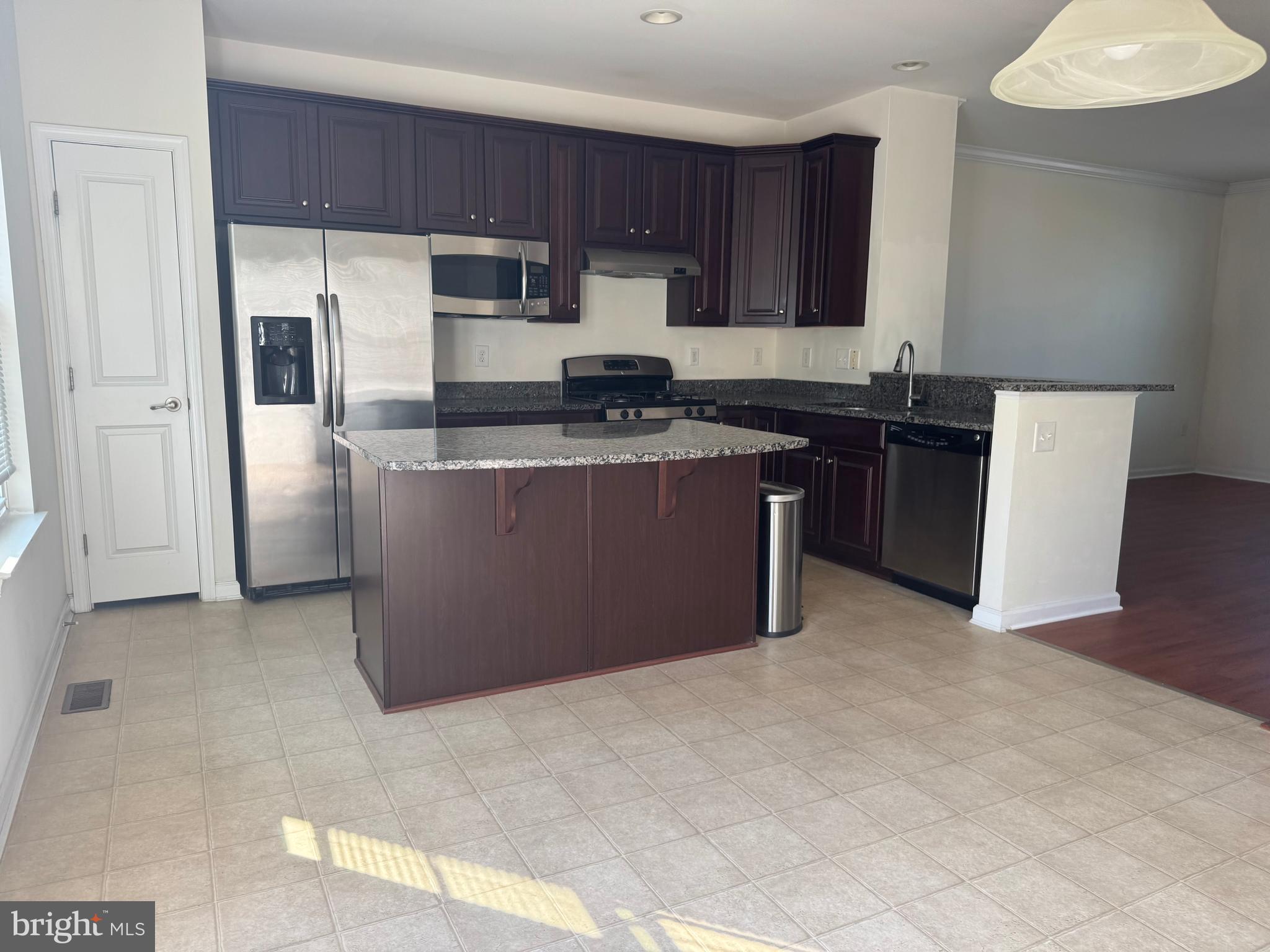 814 Susan Circle North Wales, PA 19454 - Photo 11 of 39 a kitchen with stainless steel appliances granite countertop a stove a refrigerator a sink and dishwasher