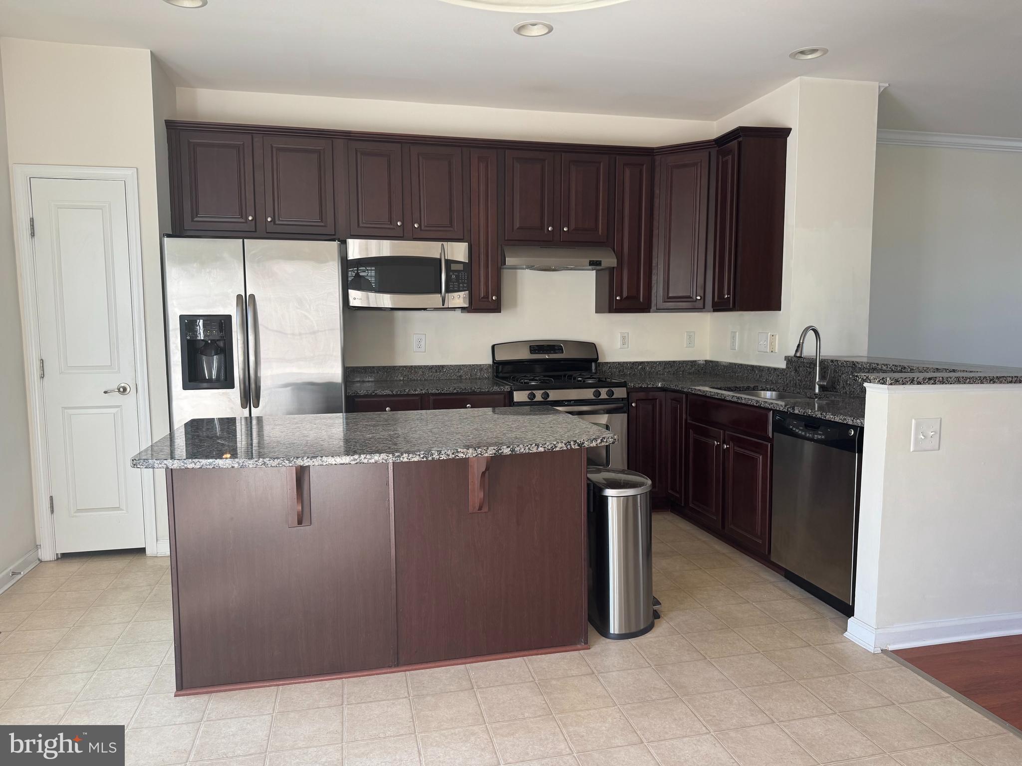 814 Susan Circle North Wales, PA 19454 - Photo 12 of 39 a kitchen with stainless steel appliances granite countertop a stove a sink a microwave a refrigerator and cabinets