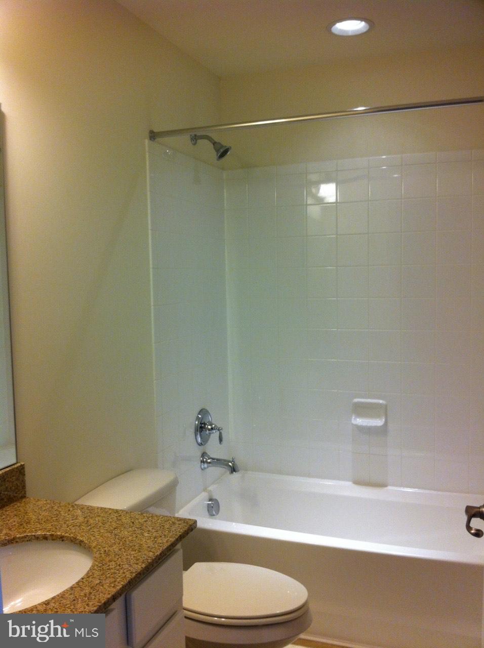 814 Susan Circle North Wales, PA 19454 - Photo 17 of 39 a bathroom with a granite countertop bathtub shower sink and toilet