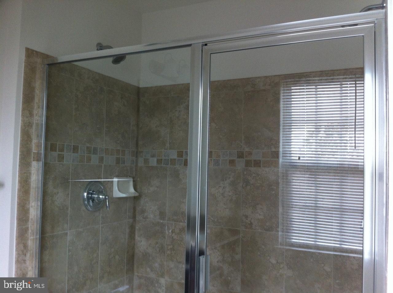 814 Susan Circle North Wales, PA 19454 - Photo 18 of 39 a bathroom with a glass shower door