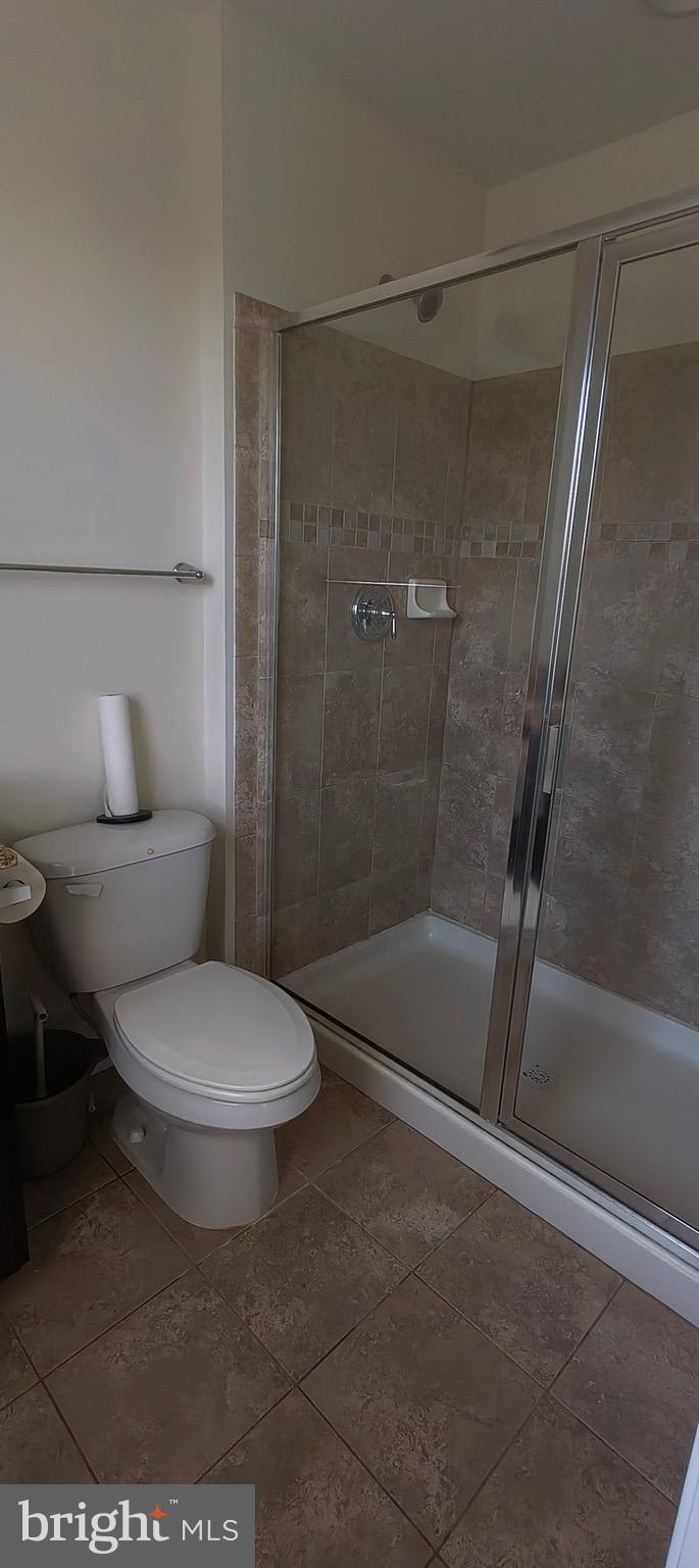 814 Susan Circle North Wales, PA 19454 - Photo 20 of 39 a white toilet sitting next to a bath tub and a shower