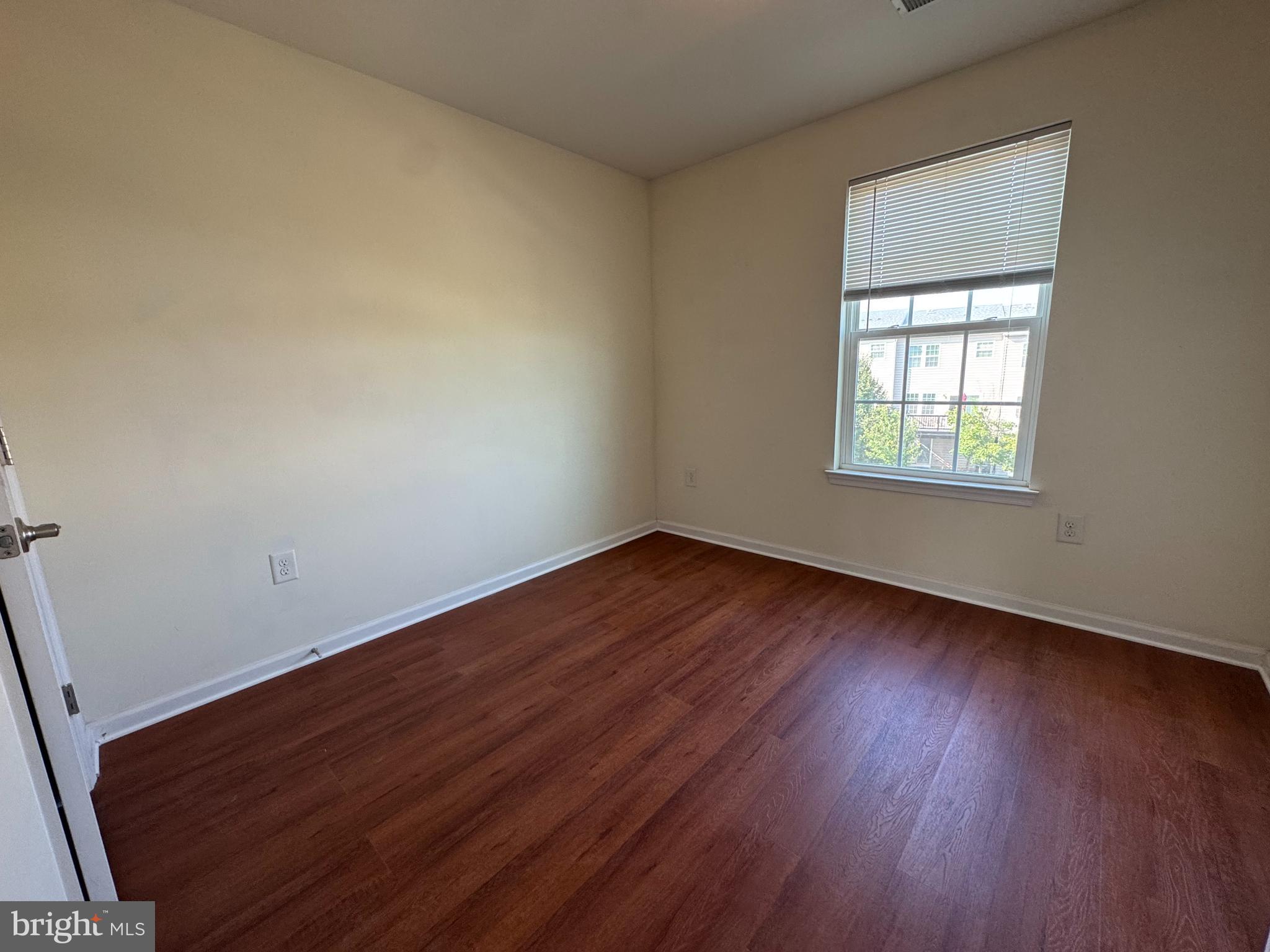 814 Susan Circle North Wales, PA 19454 - Photo 34 of 39 an empty room with wooden floor and windows