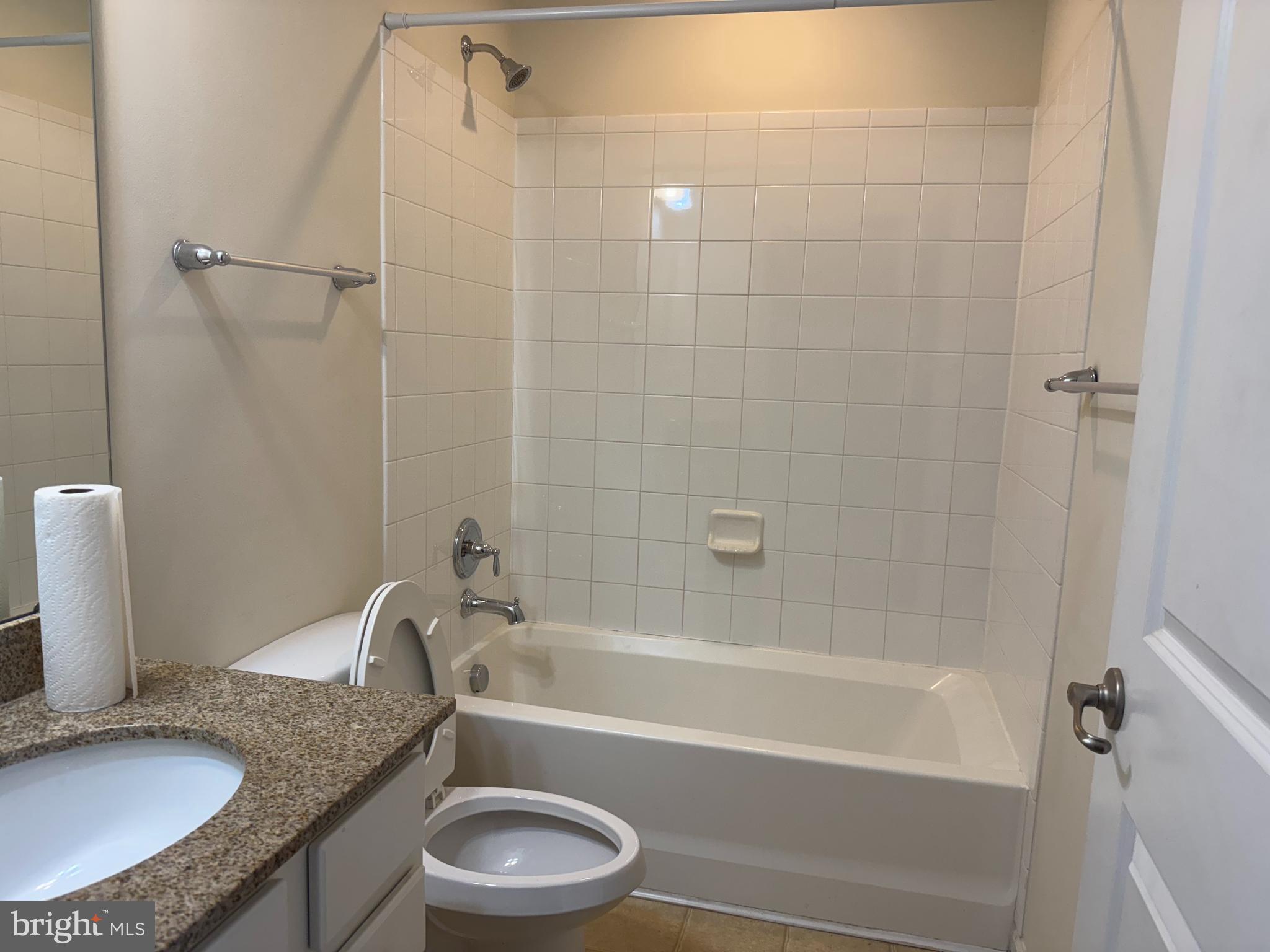 814 Susan Circle North Wales, PA 19454 - Photo 36 of 39 a bathroom with a granite countertop bathtub shower sink vanity and toilet