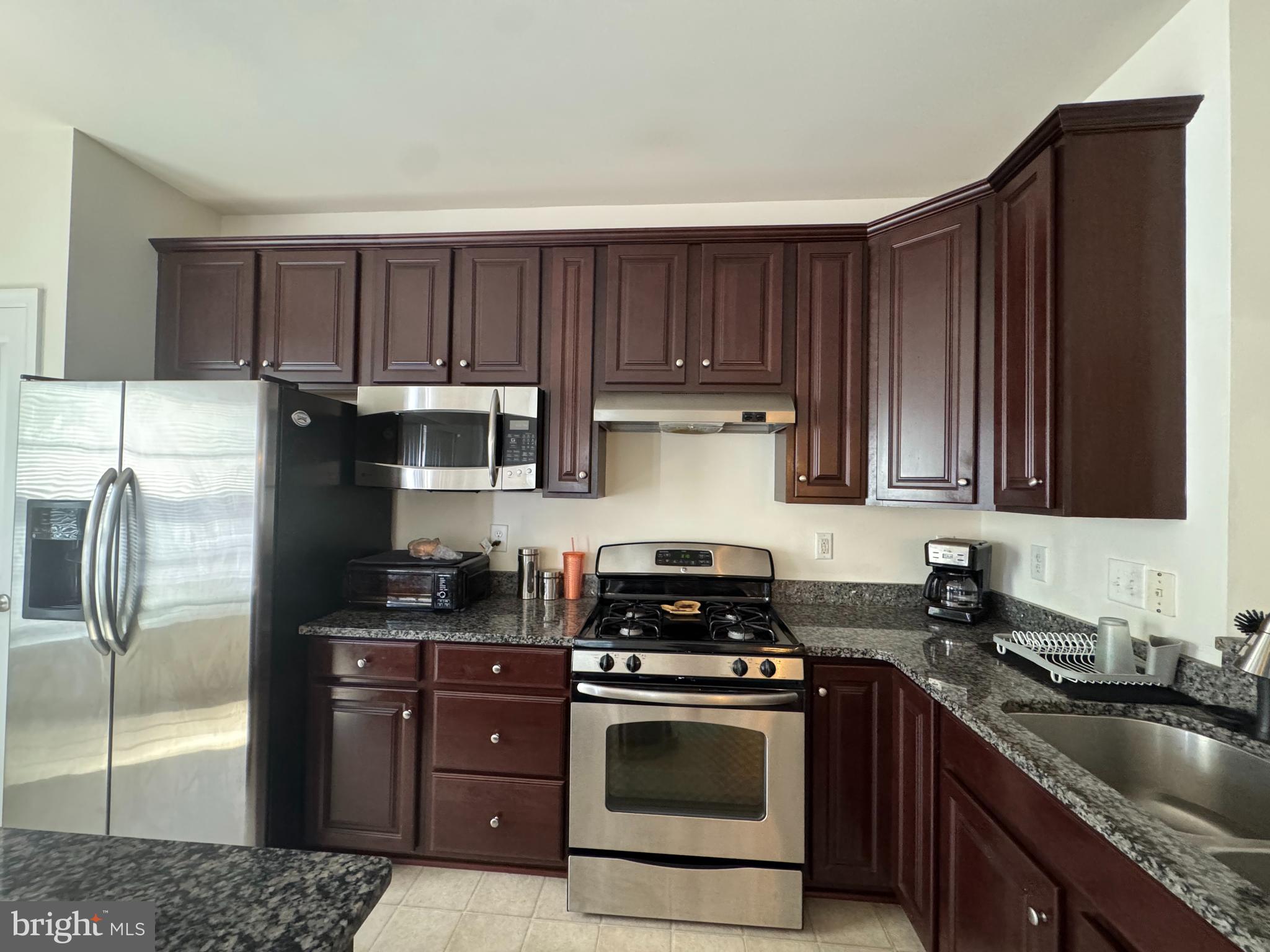 814 Susan Circle North Wales, PA 19454 - Photo 10 of 39 a kitchen with a sink stove and refrigerator