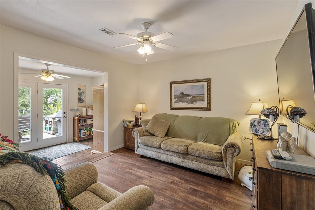 713 Midway Road Tool, TX 75143 - Photo 15 of 28 a living room with furniture and a flat screen tv