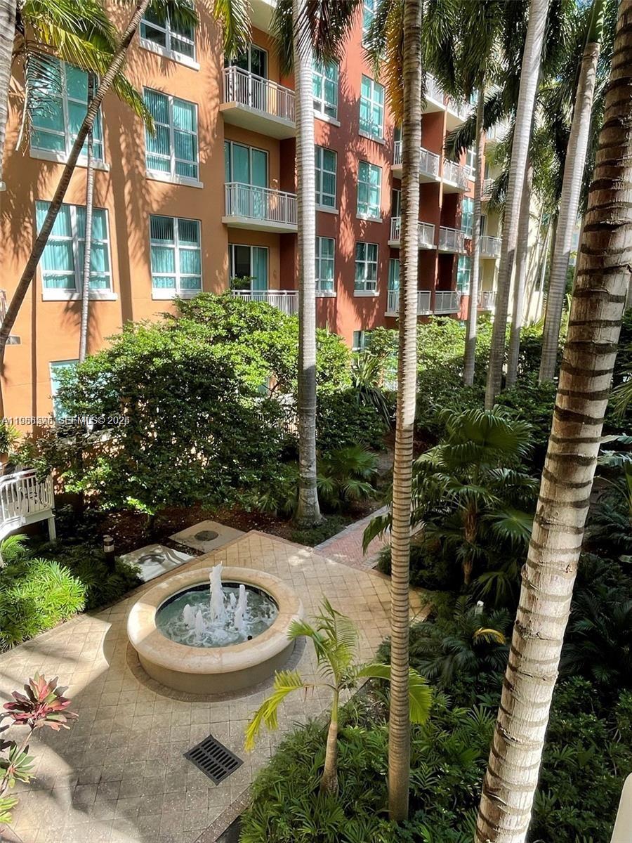 2001 Biscayne Boulevard, Unit 2217 Miami, FL 33137 - Photo 16 of 27 a backyard of a house with yard and outdoor seating