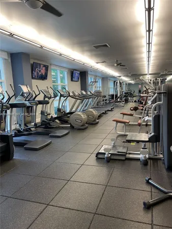 a front view of a building with outdoor seating