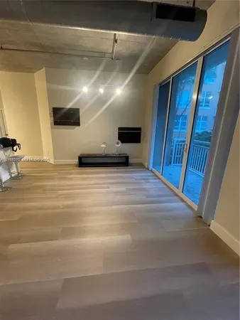 a view of a hallway with a room