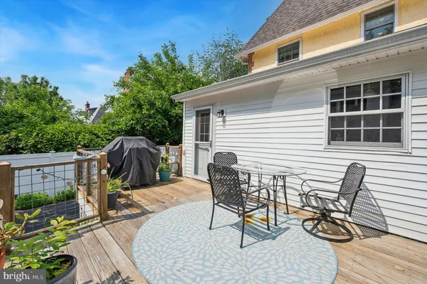 a house with a flower garden in front of it