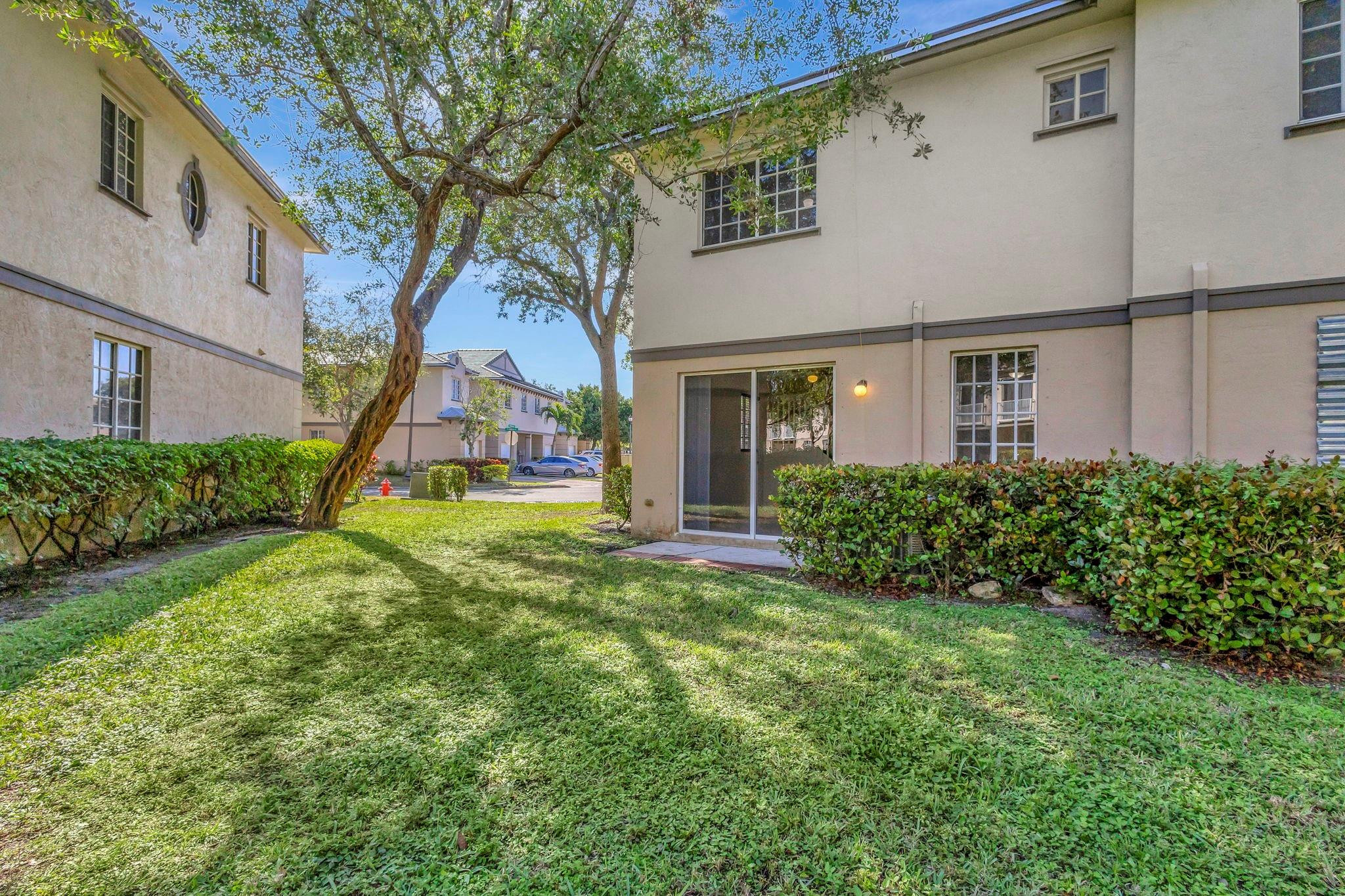 1000 Flamingo Place Riviera Beach, FL 33404 - Photo 33 of 83 a view of a house with a yard