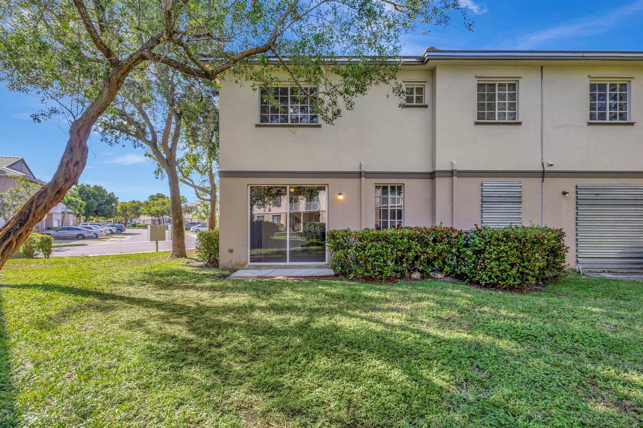 1000 Flamingo Place Riviera Beach, FL 33404 - Photo 34 of 83 front view of a house with a yard