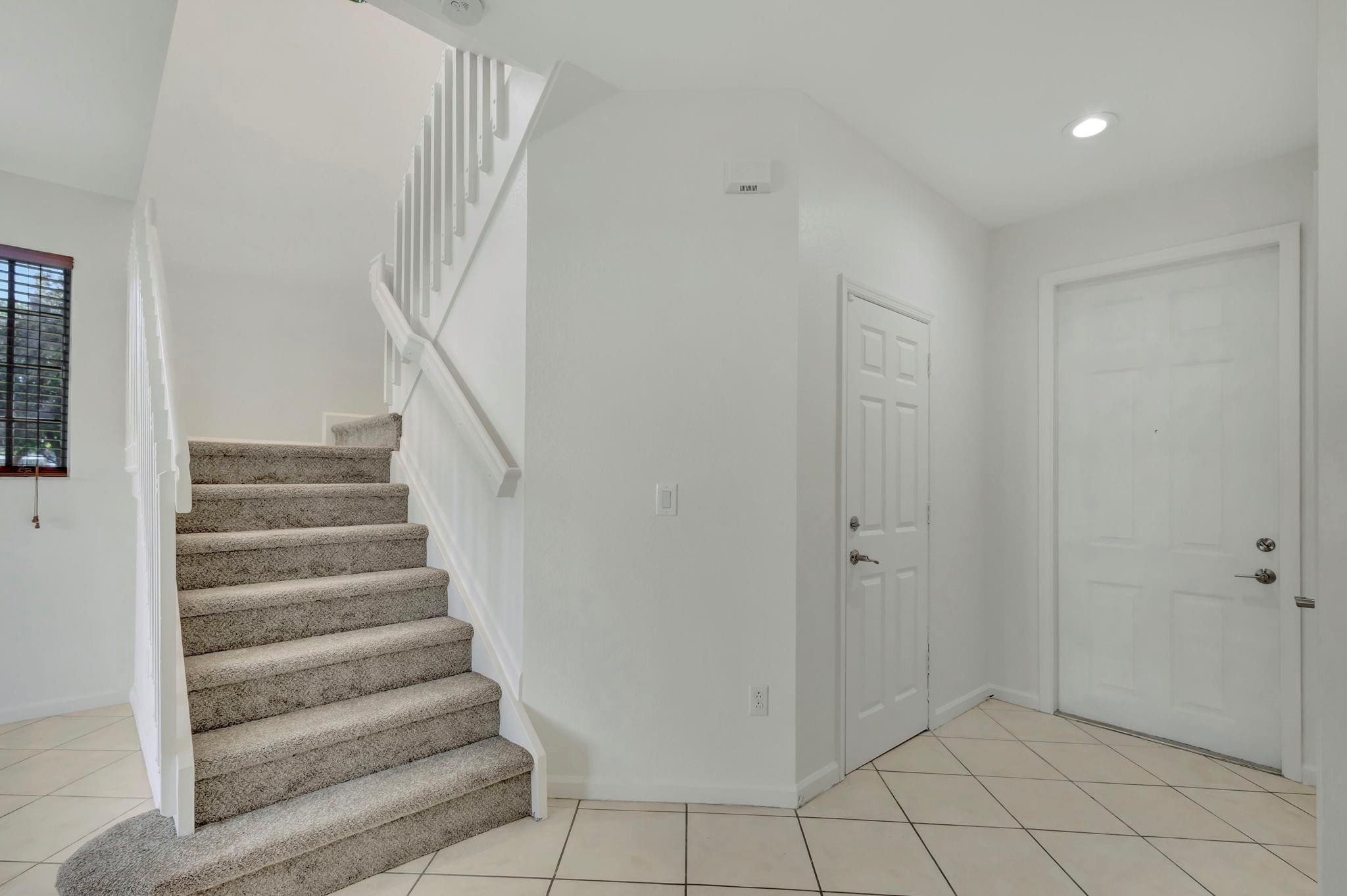 1000 Flamingo Place Riviera Beach, FL 33404 - Photo 36 of 83 a view of an entryway with staircase
