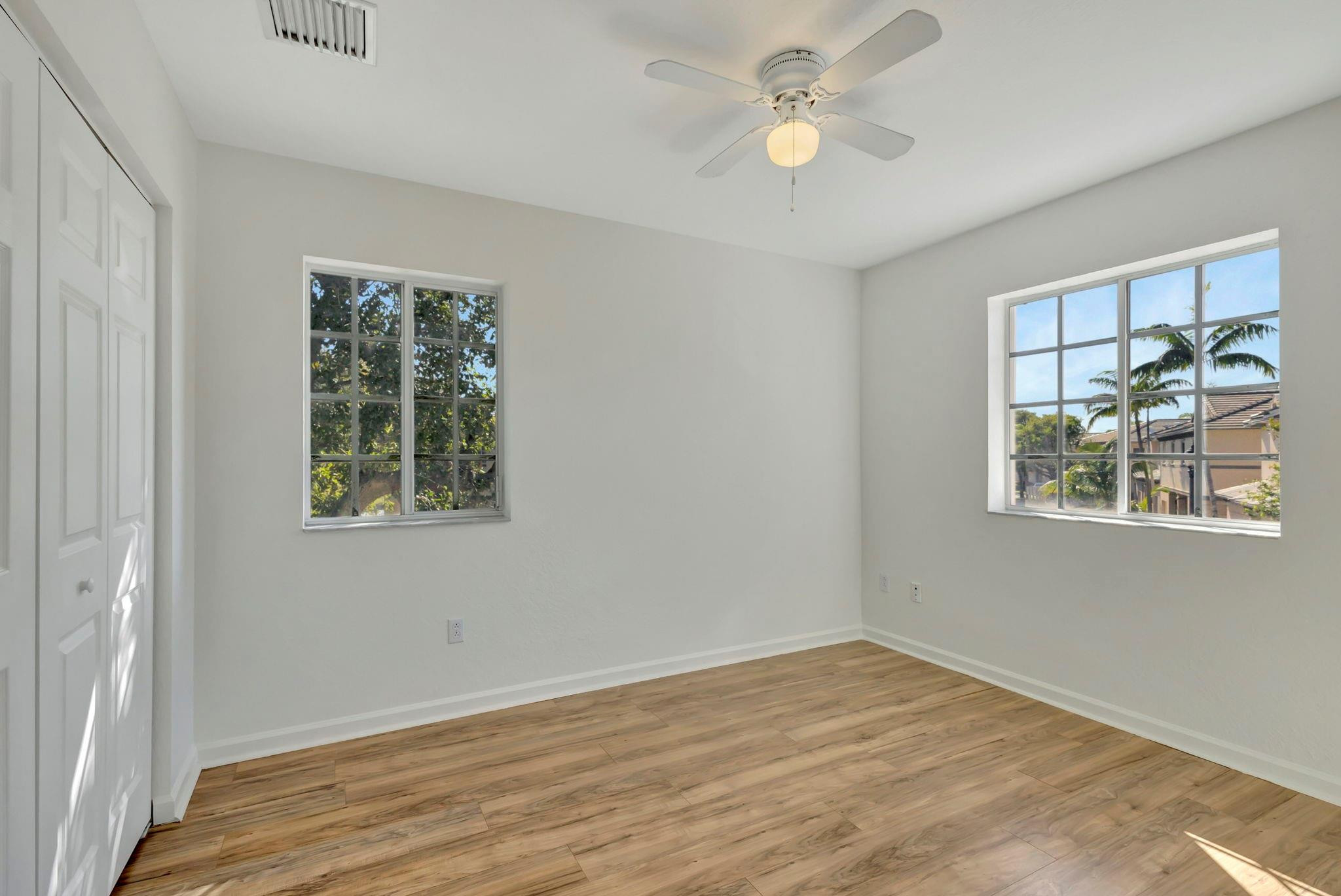 1000 Flamingo Place Riviera Beach, FL 33404 - Photo 41 of 83 wooden floor in an empty room with a window
