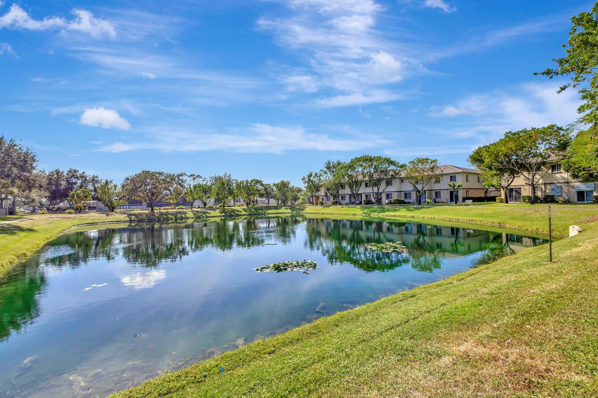 1000 Flamingo Place Riviera Beach, FL 33404 - Photo 44 of 83 a view of a lake with houses in the back