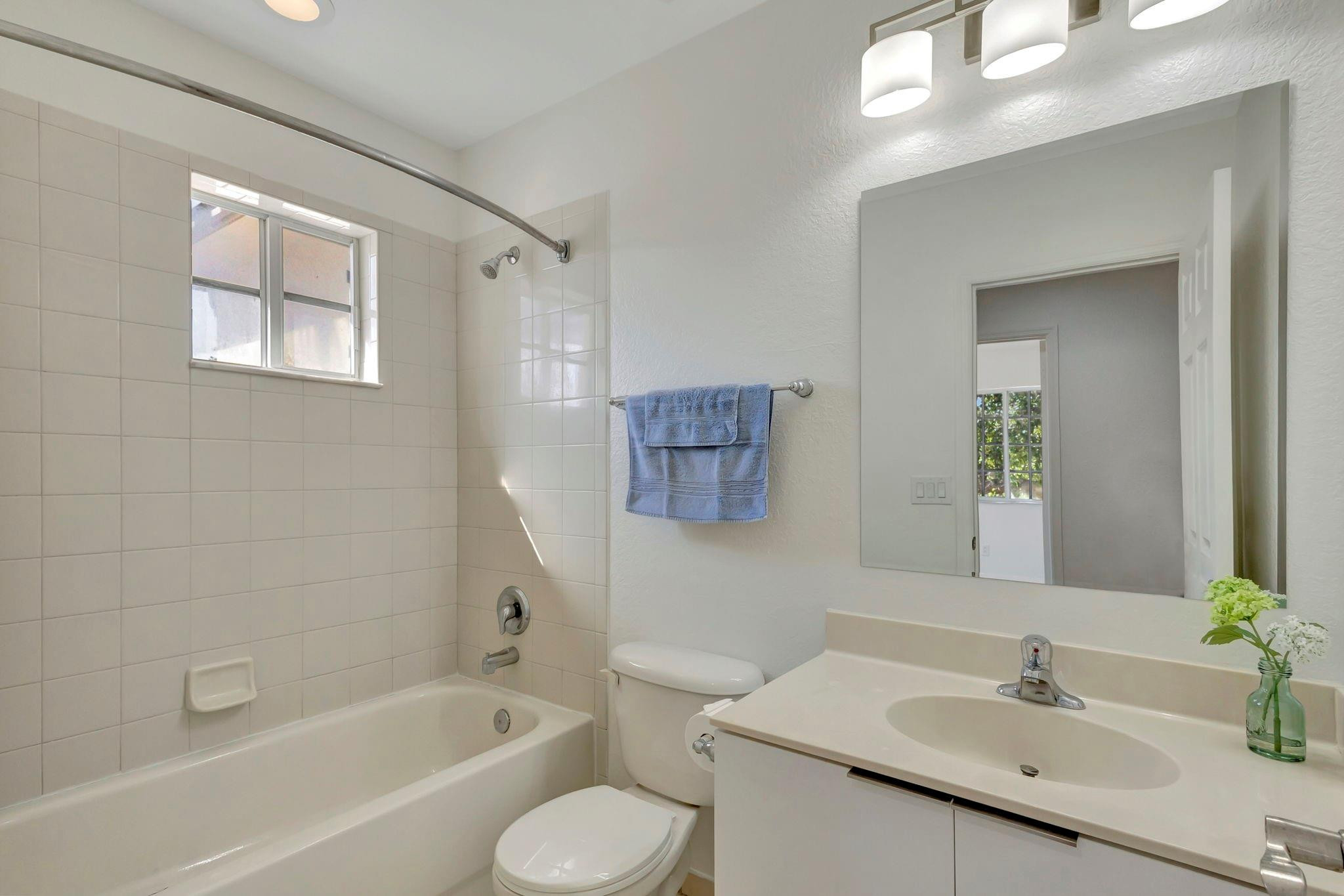 1000 Flamingo Place Riviera Beach, FL 33404 - Photo 47 of 83 a bathroom with a bathtub shower sink and a toilet