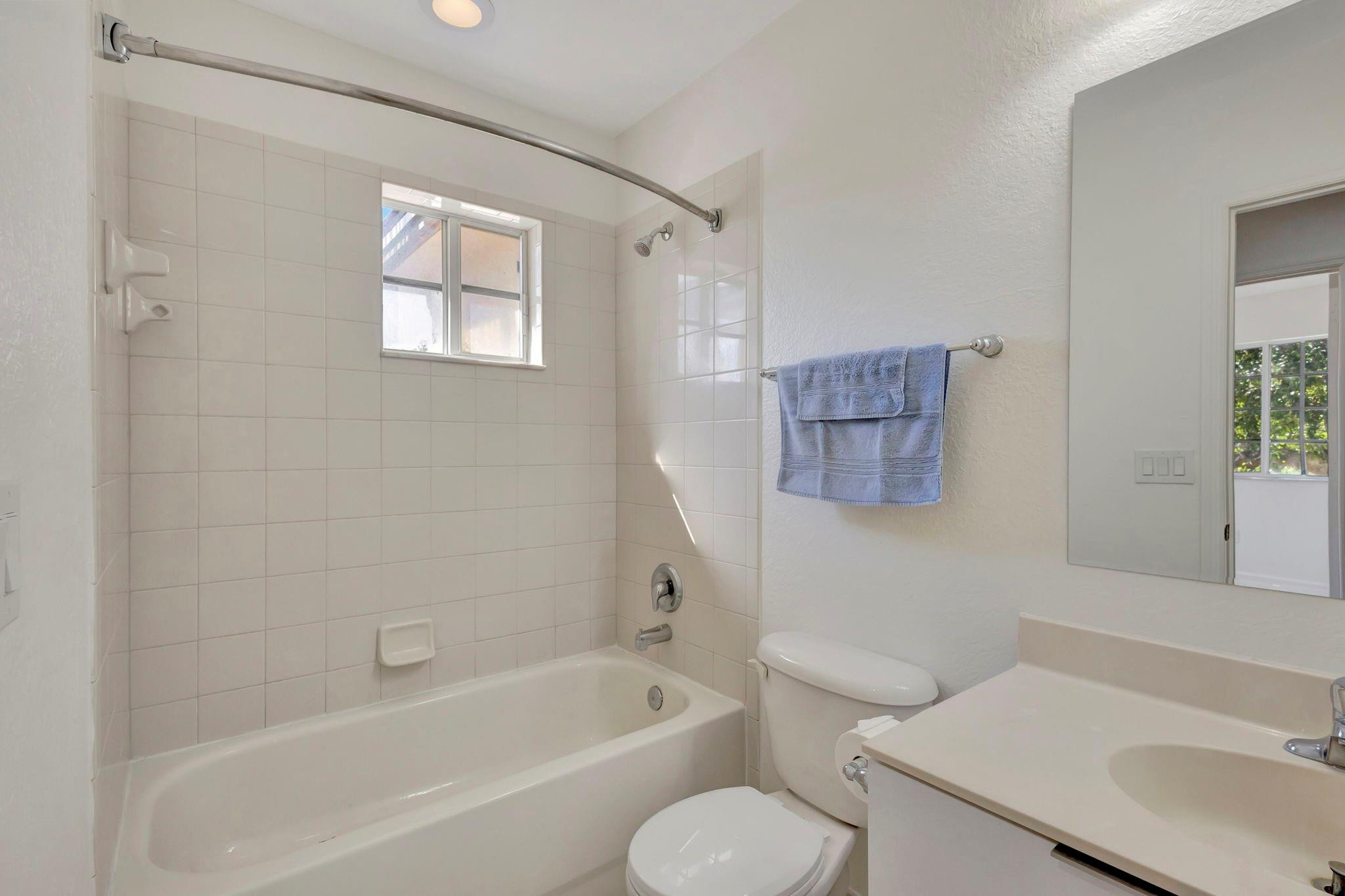 1000 Flamingo Place Riviera Beach, FL 33404 - Photo 48 of 83 a bathroom with a toilet sink and bathtub
