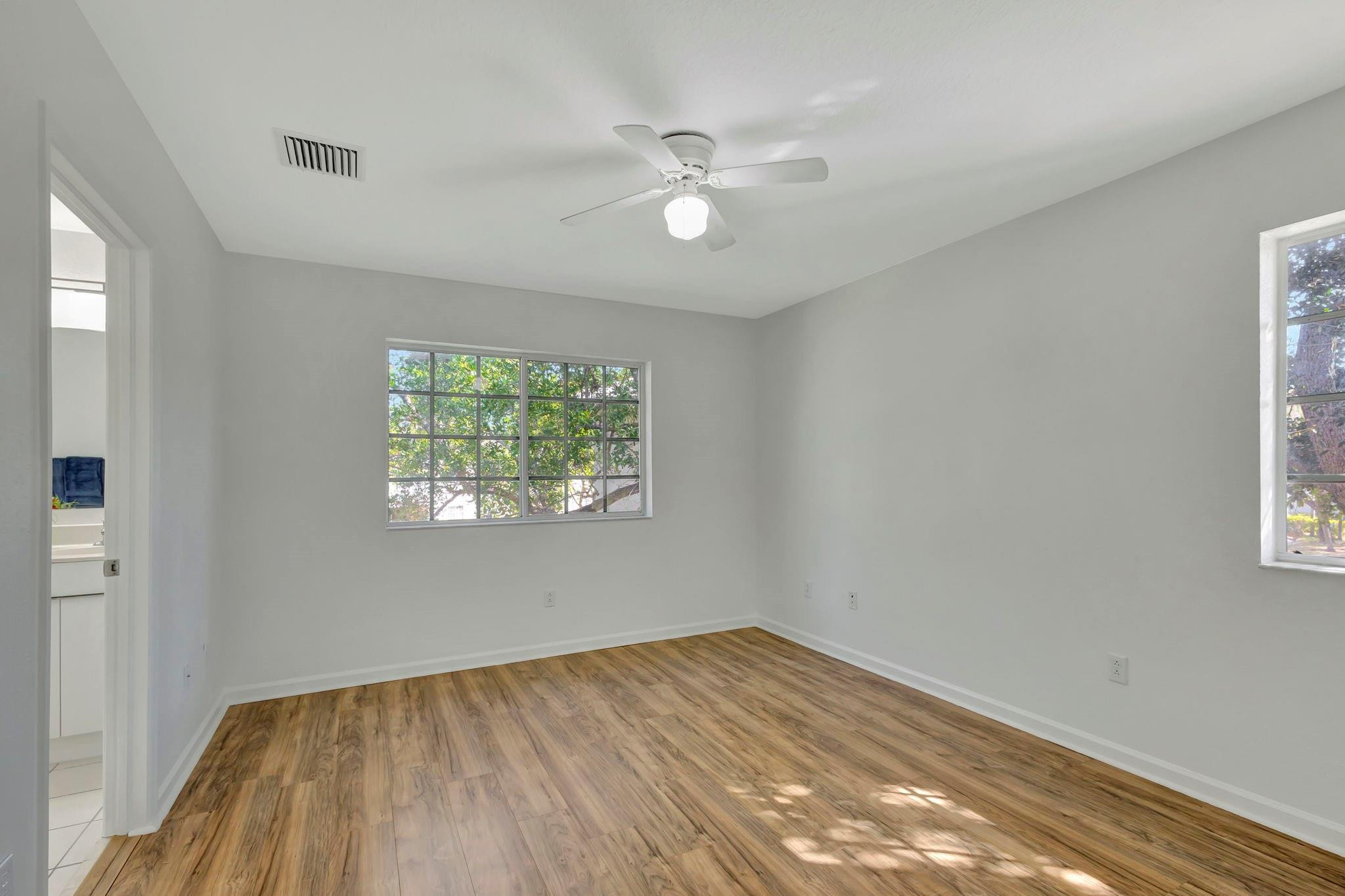 1000 Flamingo Place Riviera Beach, FL 33404 - Photo 50 of 83 wooden floor in an empty room with a window