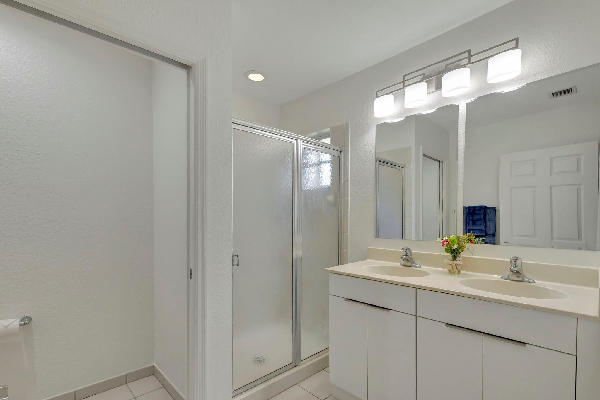 1000 Flamingo Place Riviera Beach, FL 33404 - Photo 55 of 83 a bathroom with a double vanity sink and a mirror