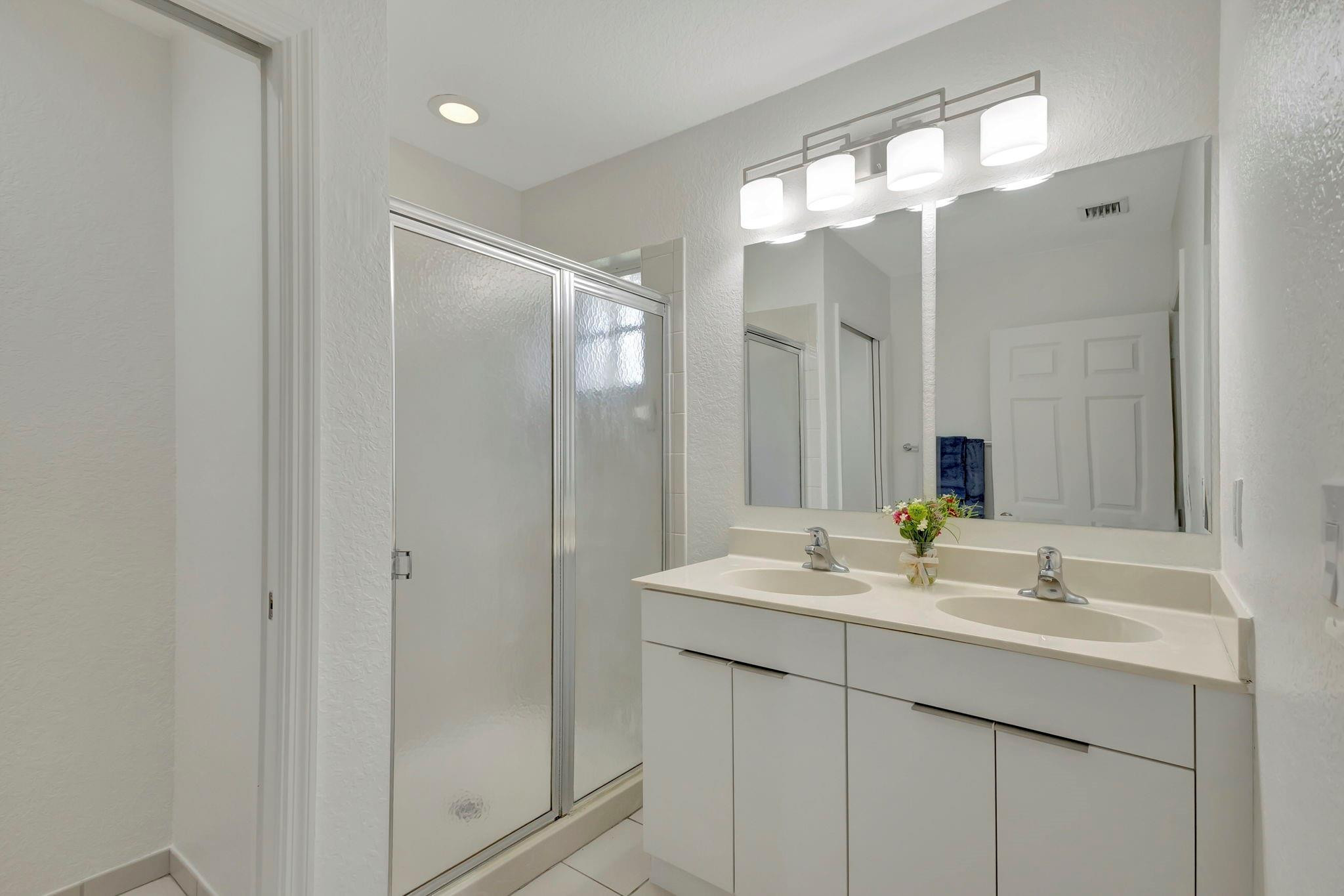 1000 Flamingo Place Riviera Beach, FL 33404 - Photo 56 of 83 a bathroom with a sink vanity and a mirror