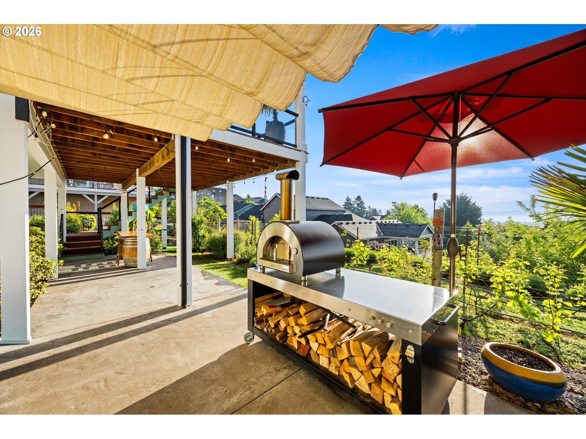199 Southwest Alder Street Dundee, OR 97115 - Photo 39 of 48 a view of a patio with table and chairs under an umbrella