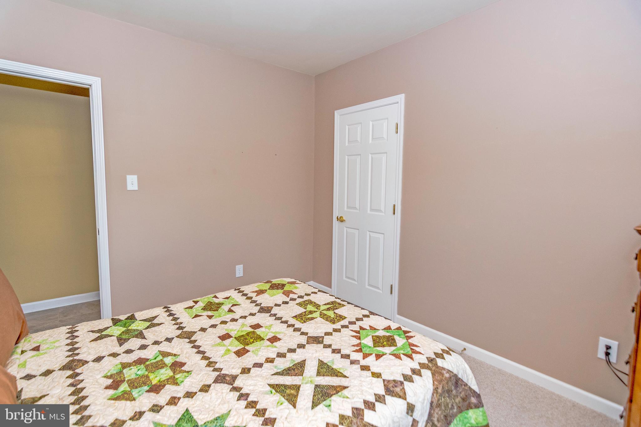 3273 Williams Point Road Marion Station, MD 21838 - Photo 36 of 61 a bedroom with a bed and a window