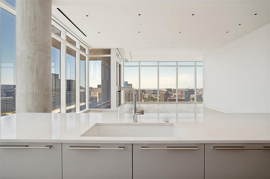 1747 Leonard Street, Unit 2002 Dallas, TX 75201 - Photo 5 of 33 a view of a kitchen with a sink and large window