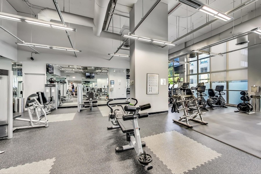 655 West Irving Park Road, Unit 3804 Chicago, IL 60613 - Photo 6 of 8 a view of a room with gym equipment