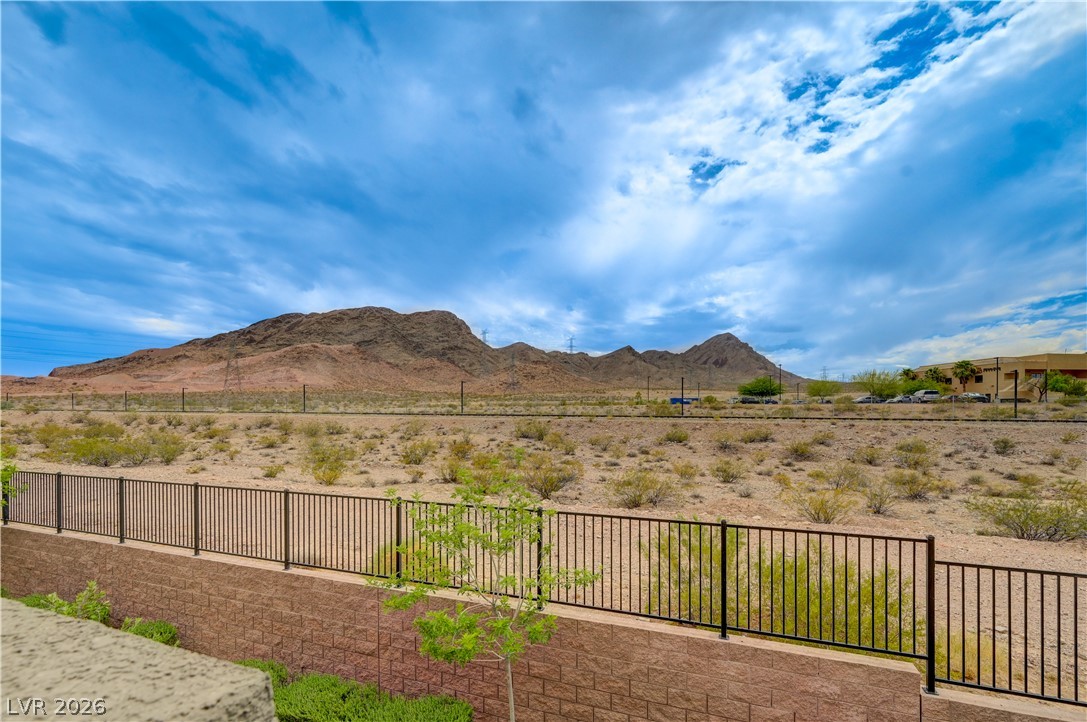 1287 Raritan Place Henderson, NV 89002 - Photo 20 of 21 A tranquil desert landscape unfolds with distant mountains under an expansive sky.