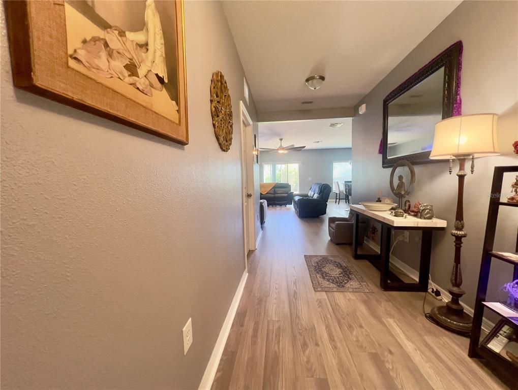13149 Conquistador Loop Spring Hill, FL 34610 - Photo 11 of 30 a living room with furniture and a table