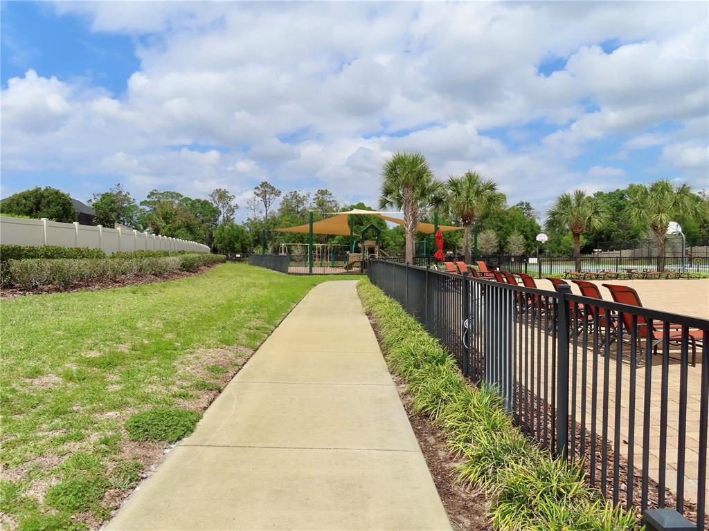 13149 Conquistador Loop Spring Hill, FL 34610 - Photo 30 of 30 a view of a garden with wooden fence