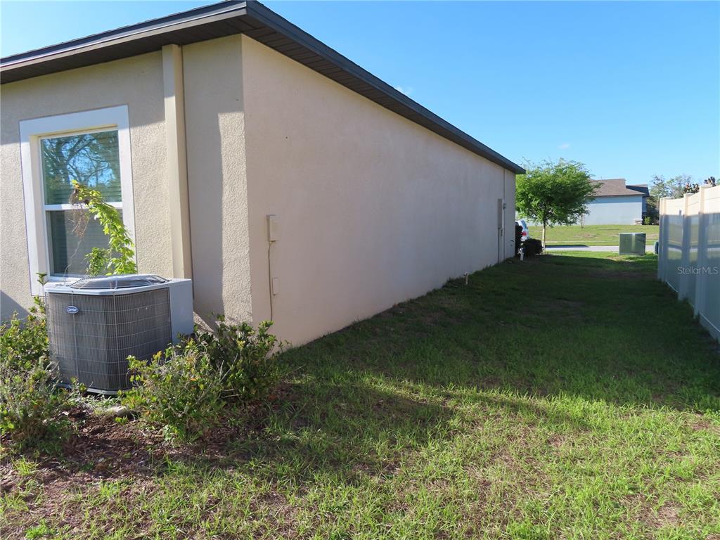 13149 Conquistador Loop Spring Hill, FL 34610 - Photo 5 of 30 a front view of a house with garden