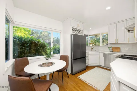 a kitchen with a sink and a large window
