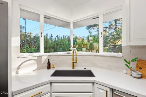 a bathroom with a sink toilet and mirror