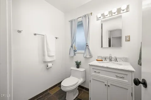 a bedroom with a bed and a desk