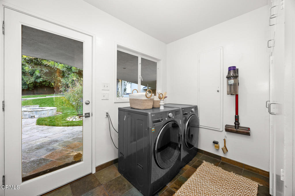 1620 Knollwood Drive Pasadena, CA 91103 - Photo 28 of 59 a view of a storage and utility room with washer and dryer