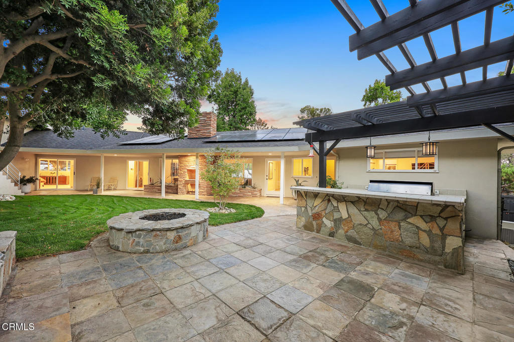 1620 Knollwood Drive Pasadena, CA 91103 - Photo 39 of 59 a view of a patio with table and chairs and potted plants