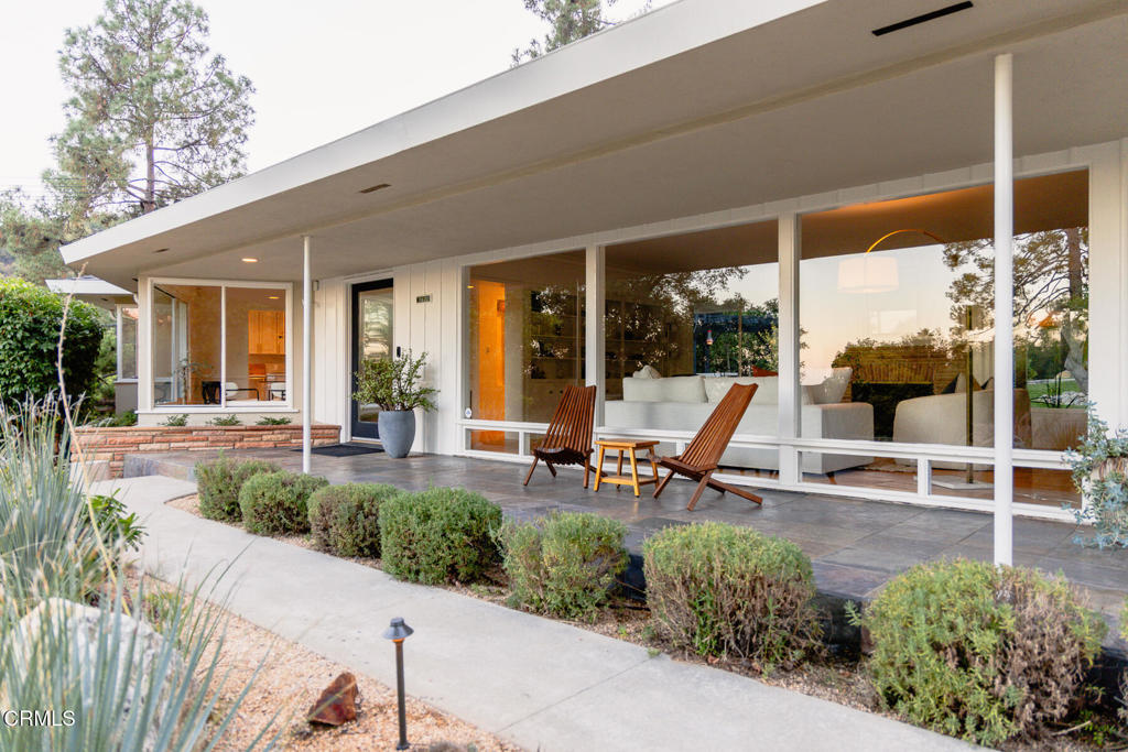 1620 Knollwood Drive Pasadena, CA 91103 - Photo 40 of 59 a view of a patio with table and chairs potted plants and floor to ceiling window