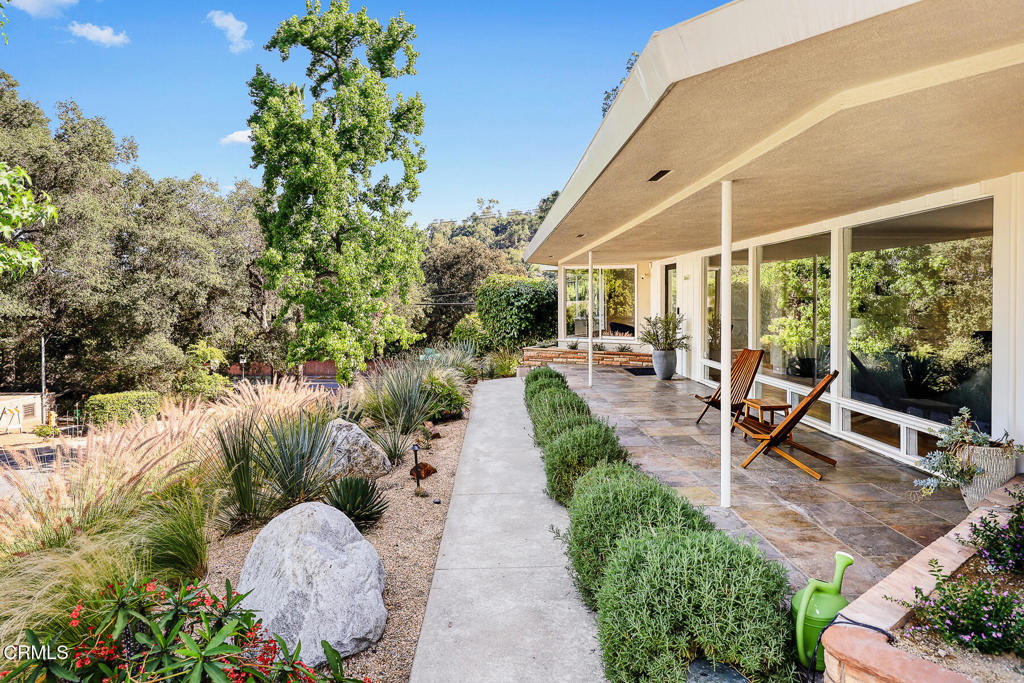 1620 Knollwood Drive Pasadena, CA 91103 - Photo 48 of 59 a view of a swimming pool with a patio and garden