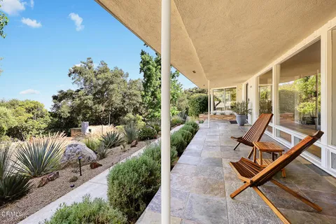 a view of a area with mountains in the background